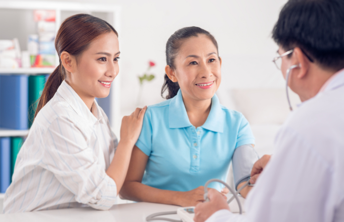 Woman visiting doctor with her mother