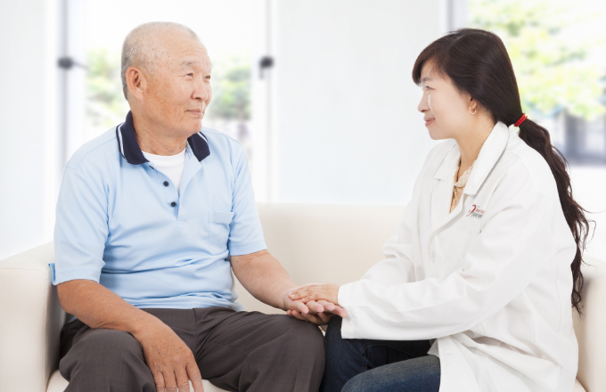 friendly doctor caring senior man indoor room