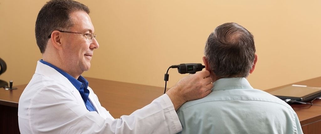 Audiologist doing a video ear canal inspection