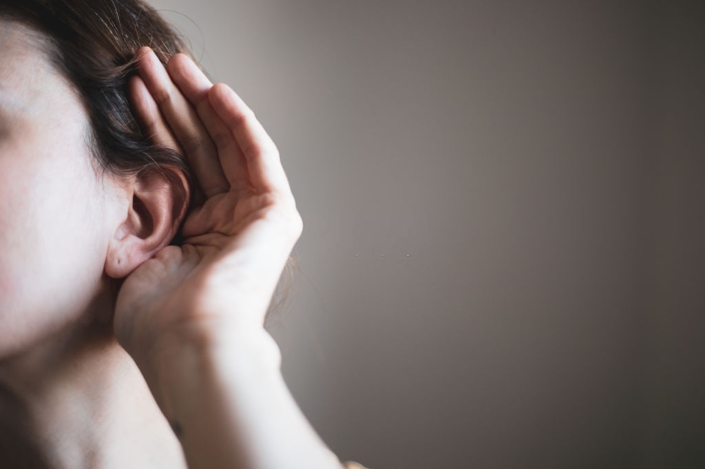 A woman's ear, listening